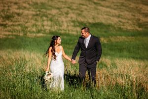 Couple walking in a field in Brooksvale State Park in Connecticut in the fall