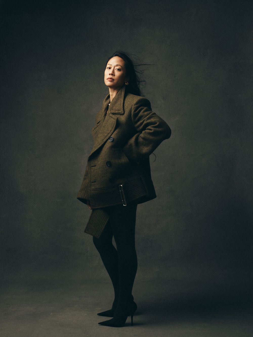 Dynamic fashion portraits showing movement and poses in dark tailored clothing.