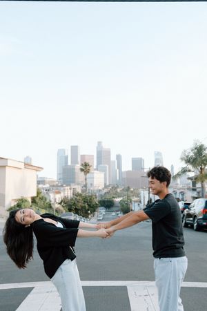 A couple in an editorial pose in downtown Los Angeles.