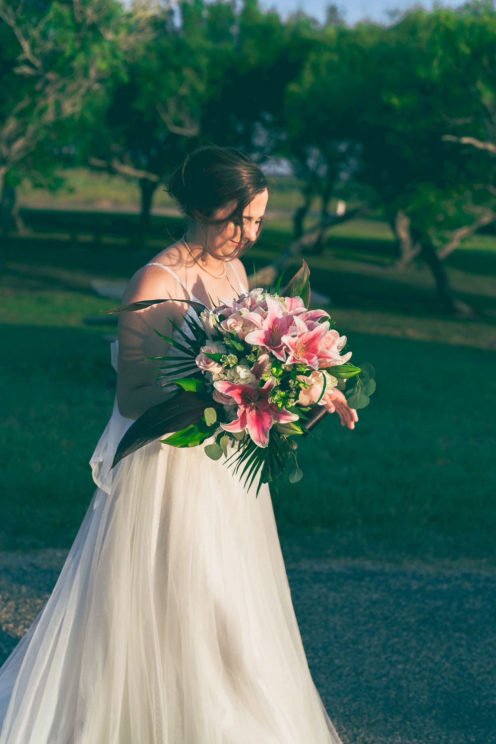 Bride and wedding gown, holding her bouquet in Rockport, Texas