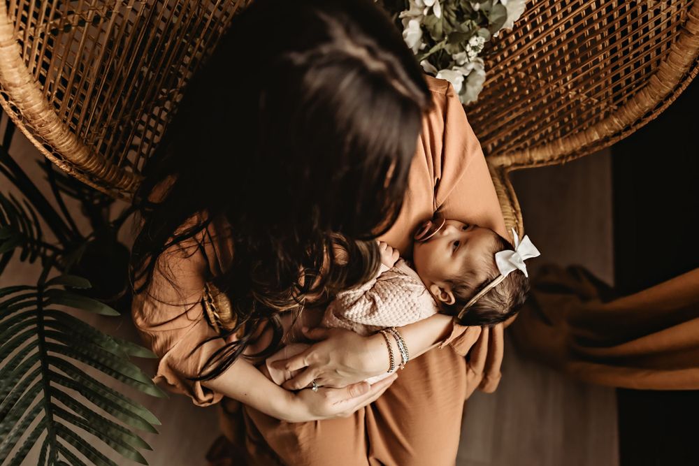 Intimate lifestyle photography with warm lighting and woven textures.