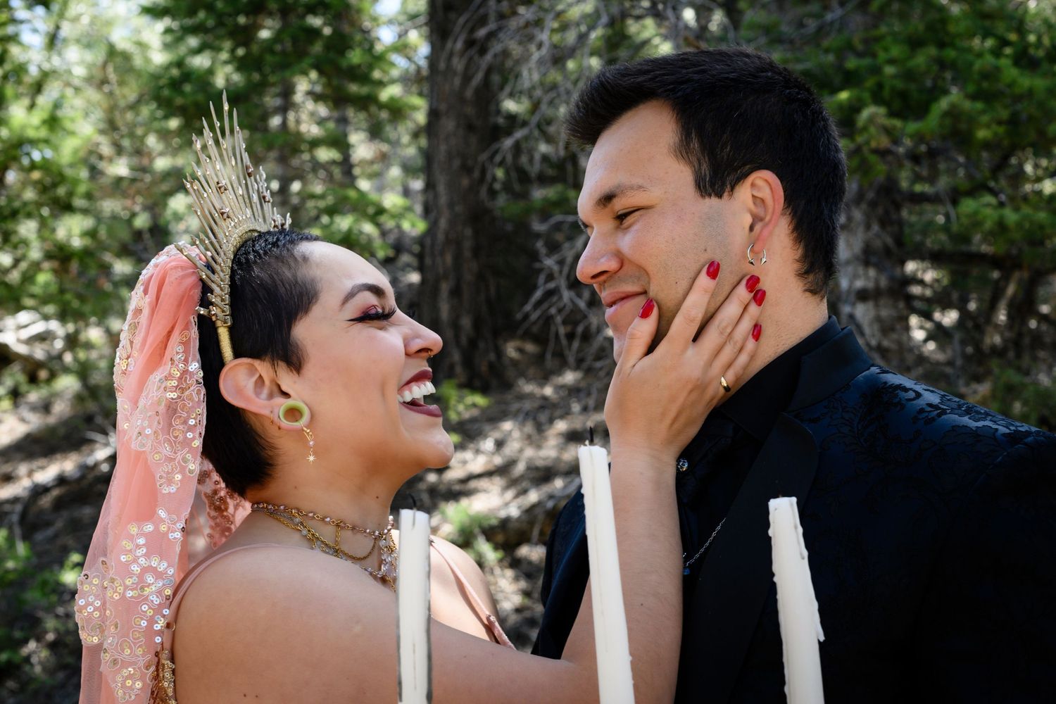 Intimate wedding moment captured as couple shares laughter in forest setting. Elopement photography in Las Vegas. Elopement photography