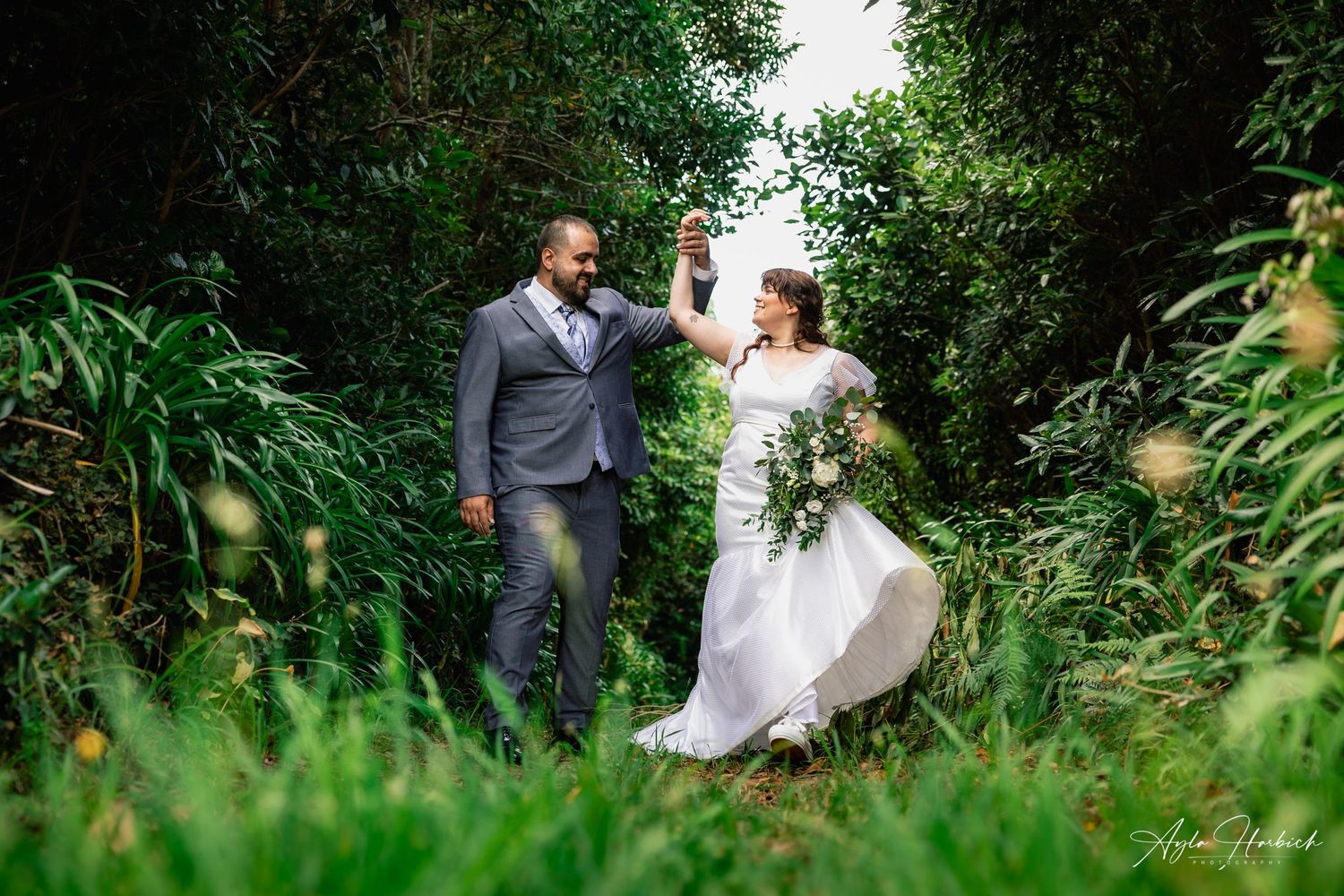 Bride and groom dancing in the forest, amazing setting, outdoor small wedding.