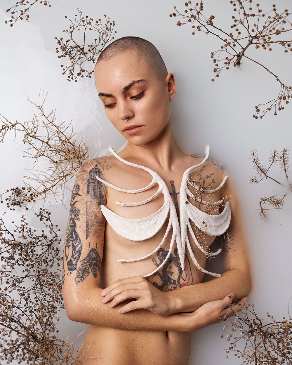 fine art portrait with ribcage bone sculpture