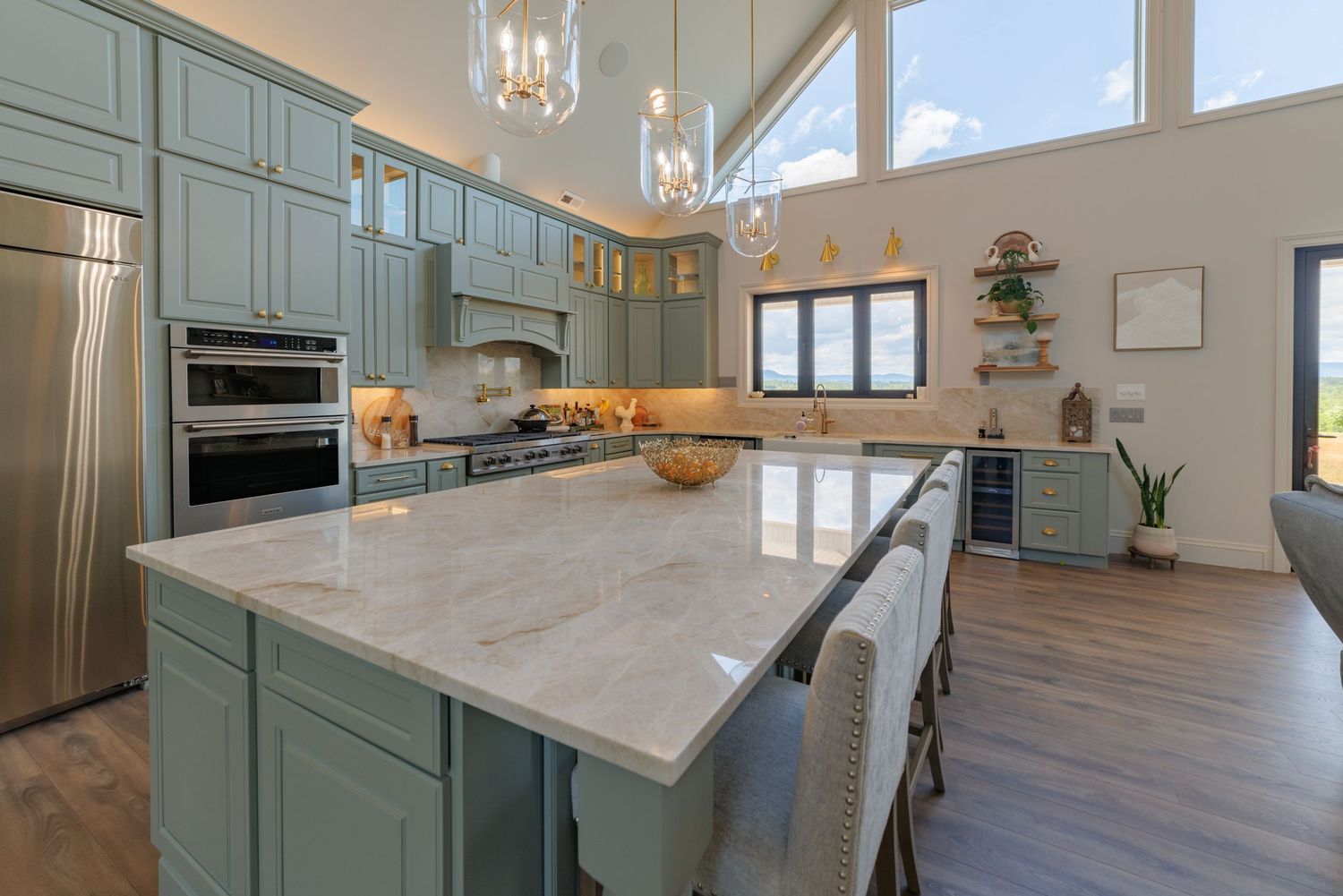 A real estate photo showcasing the beautiful kitchen of a million dollar home.