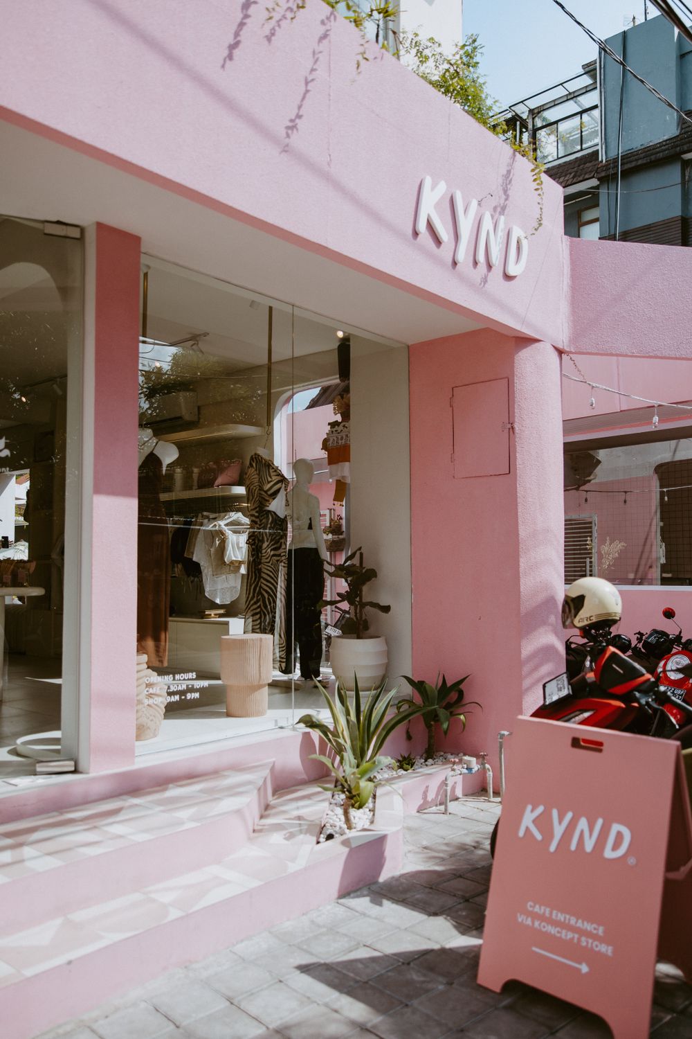 Modern pink-themed storefront with 'KYND' branding and minimalist design elements.