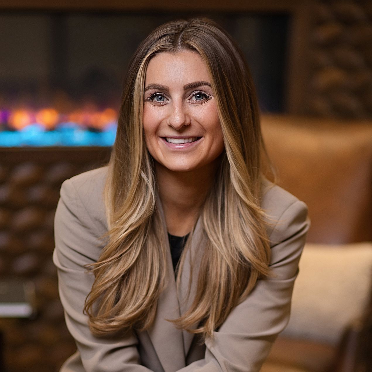 Professional headshot series of person in beige blazer with warm expression.