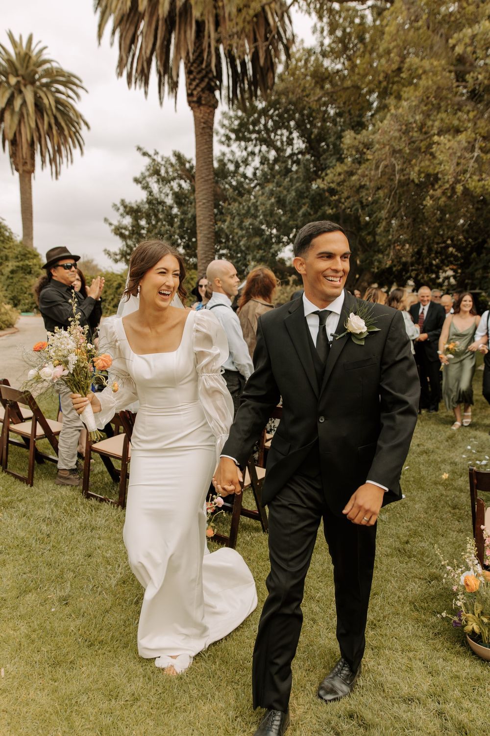 Personal wedding photo of bride and groom in a candid, emotional moment