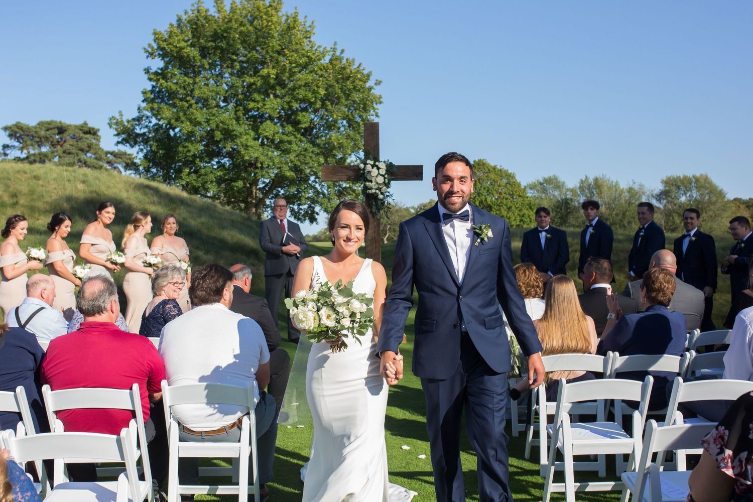 Intimate wedding ceremony in Appleton WI, capturing the bride and groom exchanging vows with emotional, natural moments and beautiful light
