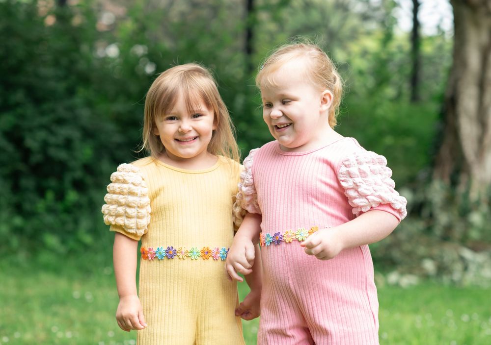 Two sisters smiling together