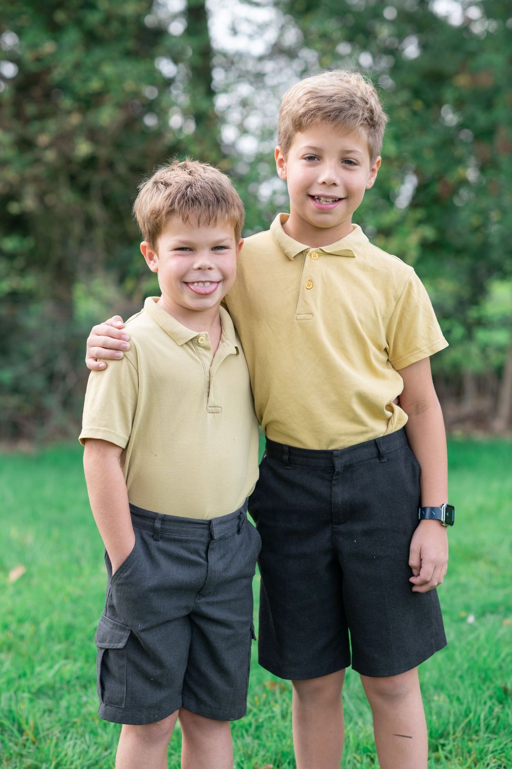 Brothers hug each other in a f un school photo in York, North Yorkshire.