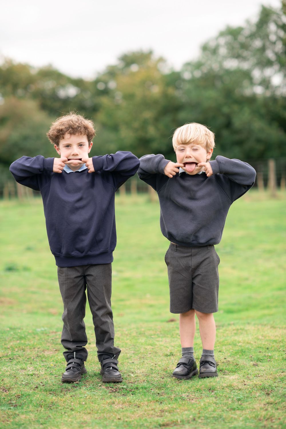 Brothers pulling funny faces