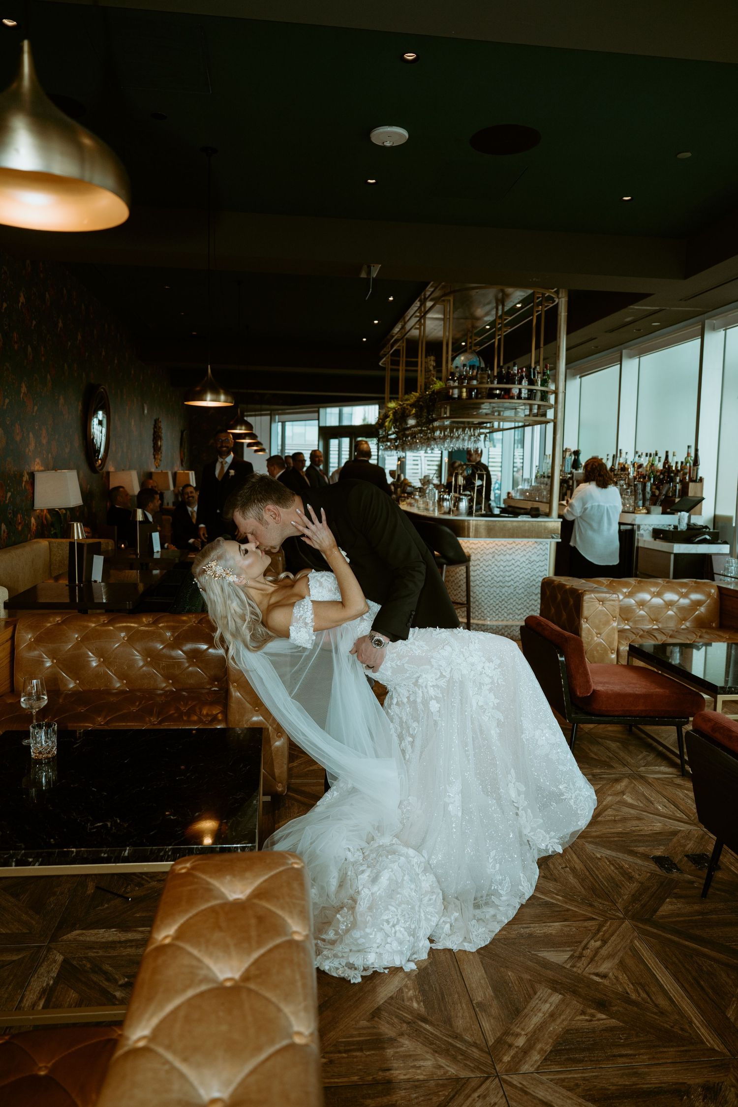 A sequence of wedding photos showing a bride in a white dress posed playfully on a brown patterned floor.