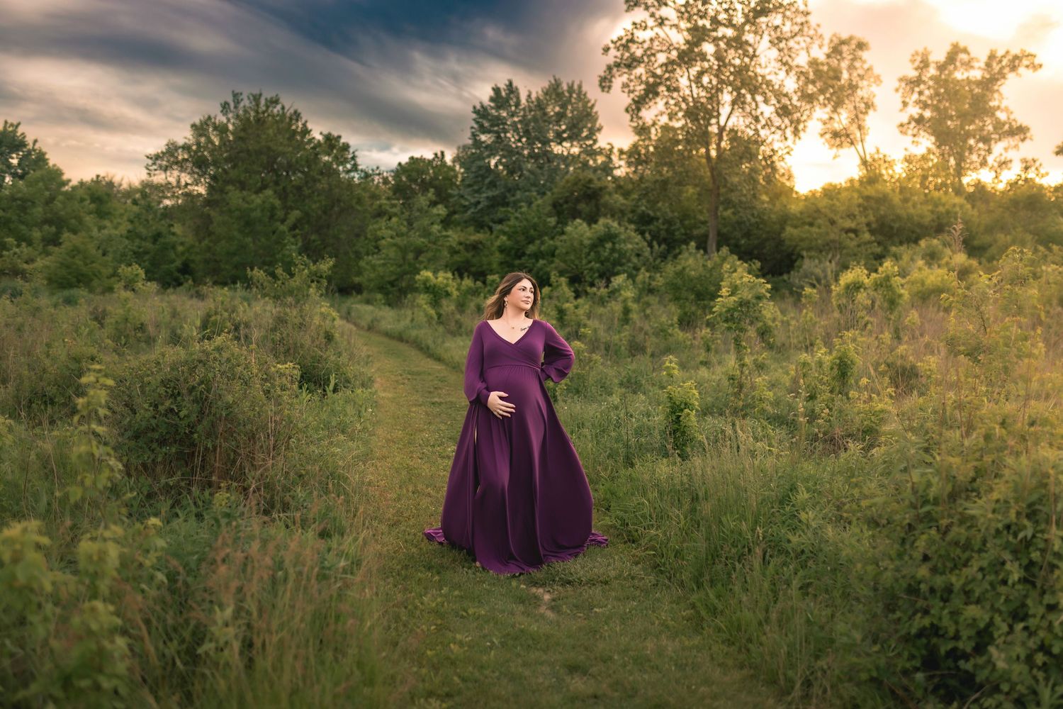 Expecting Pregnant mother who is wearing purple during photoshoot in Fort Wayne Indiana
