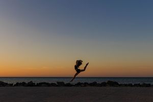 Dance photoshoot at Westport beach featuring flowing movement, ocean backdrop and golden hour lighting