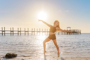 Dance photoshoot at Westport beach featuring flowing movement, ocean backdrop and golden hour lighting
