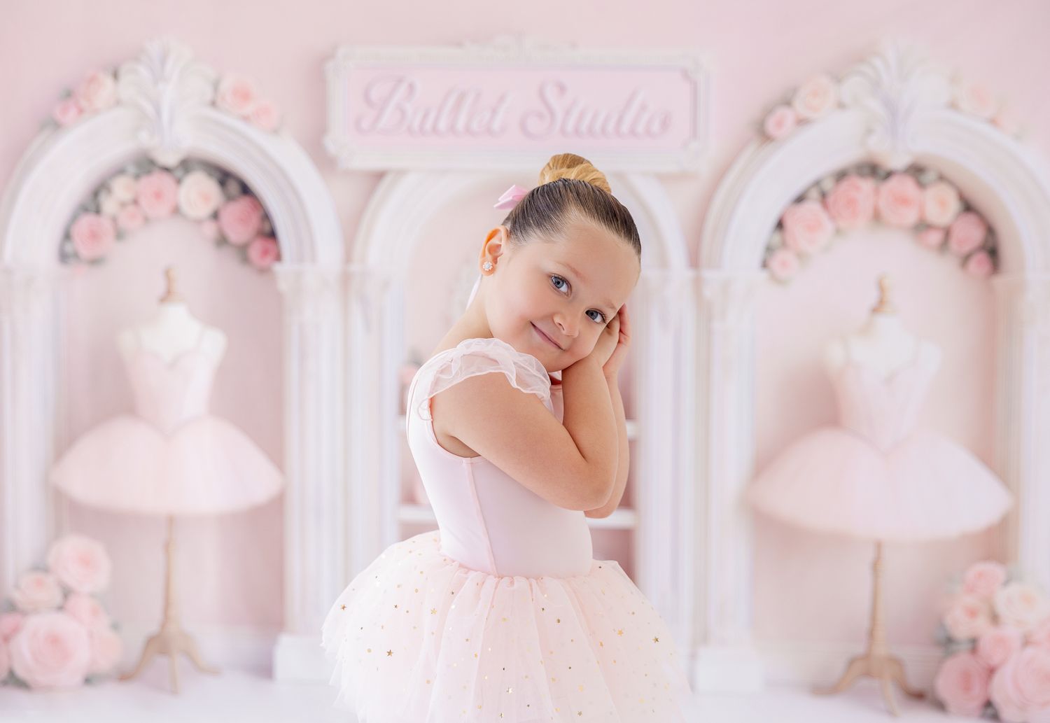 A person lying on a pink background with a decorative light-up star prop creating a dreamy aesthetic.