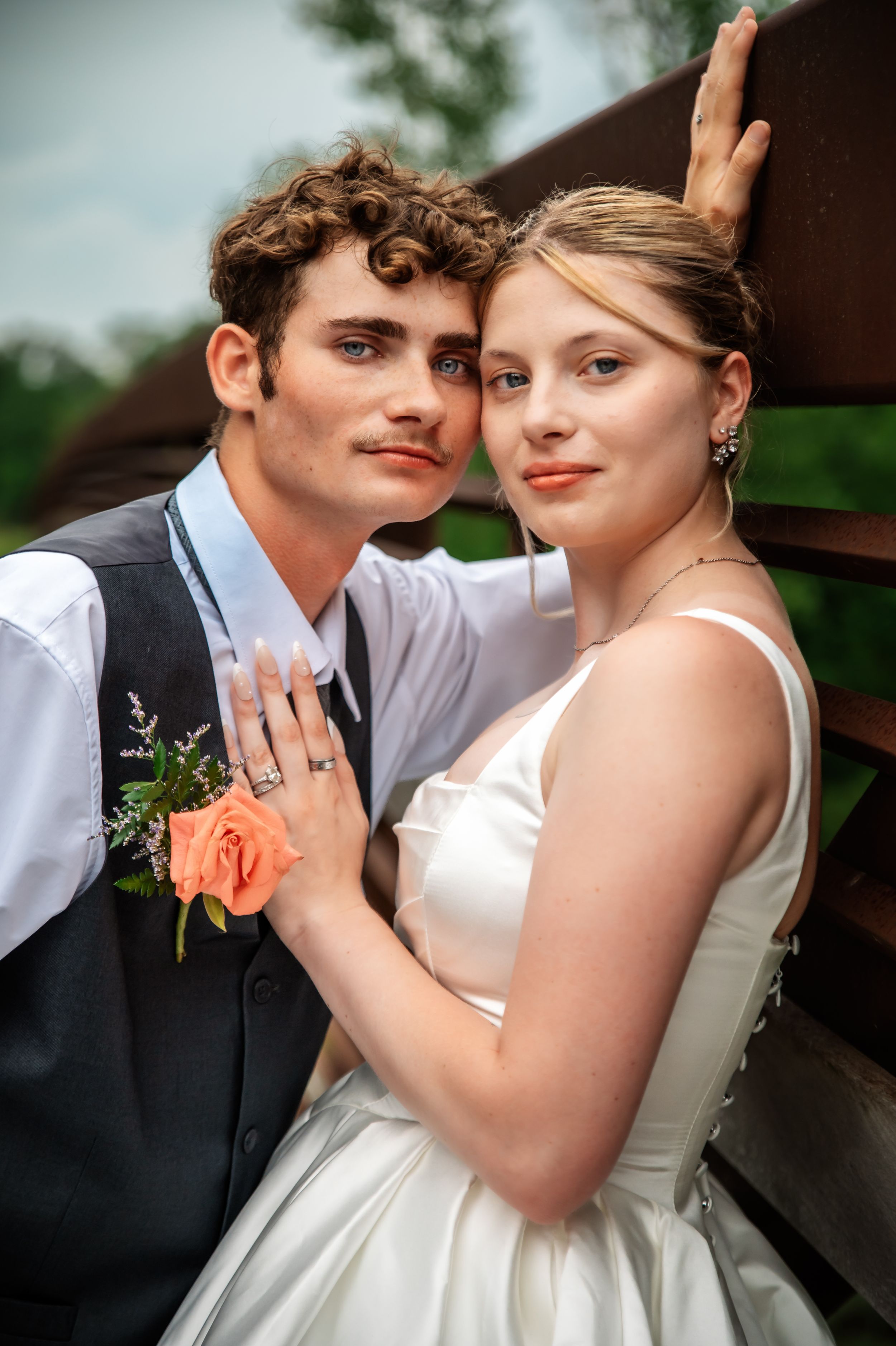 Newlywed couple embracing during their wedding photography session in Lima, Ohio