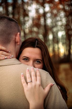 Couple snuggling during an outdoor photography session in St. Marys, Ohio