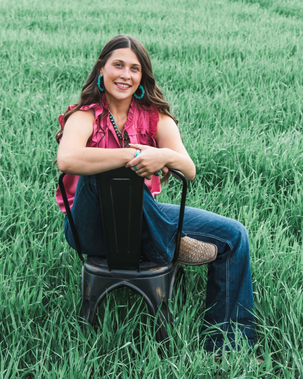 A sequence of photos showing someone sitting in a black chair surrounded by lush green grass in a field.