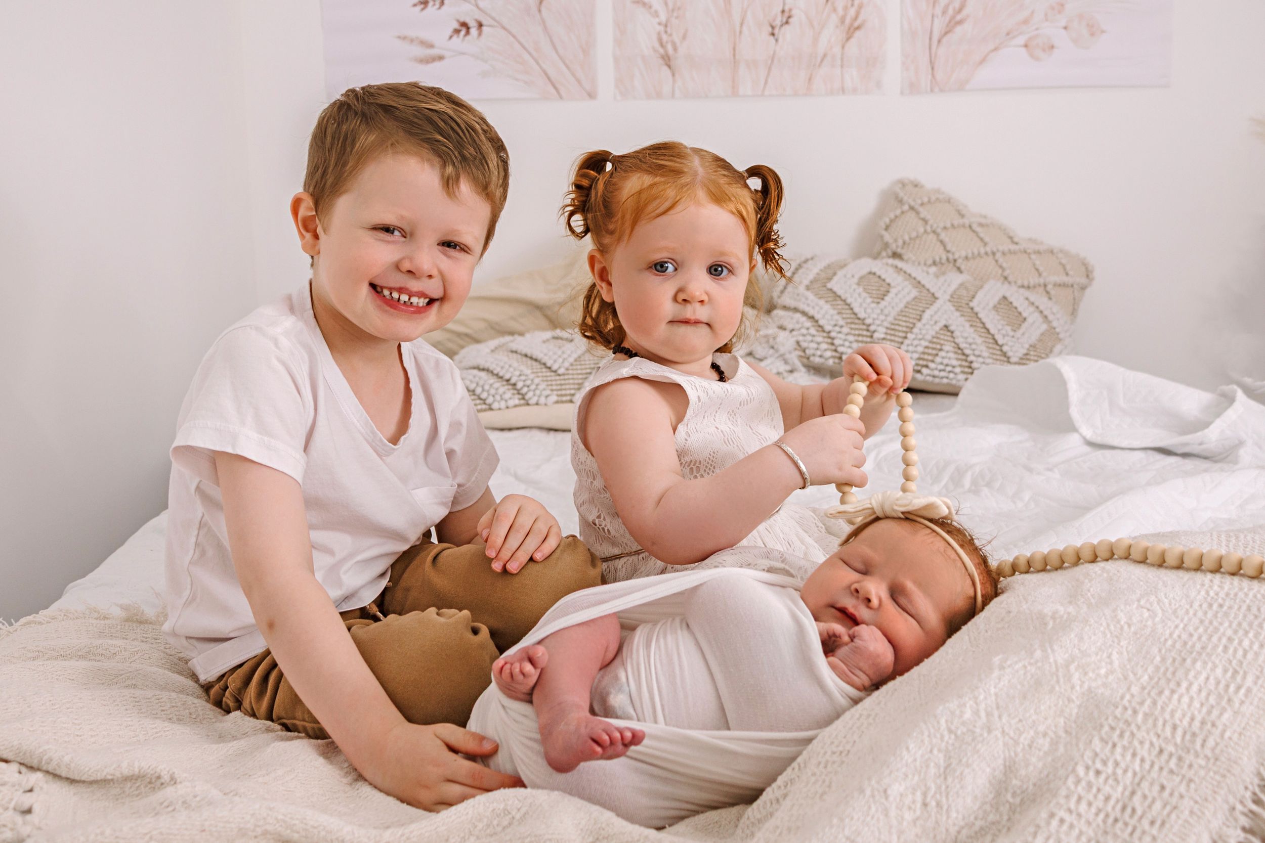 siblings at lifestyle newborn photography session