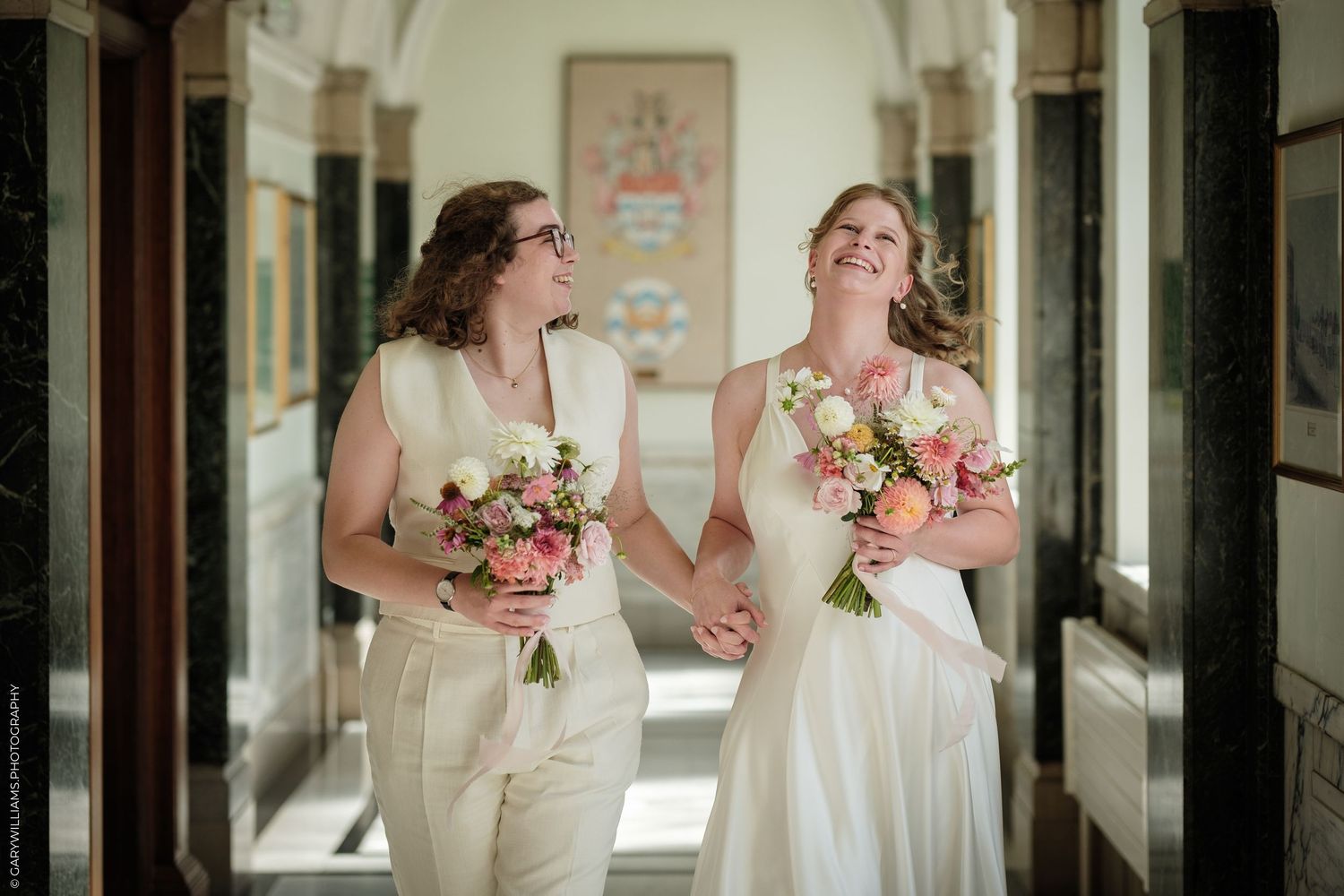 A series of black and white wedding photos showing a bride in a ballgown and guests at an elegant indoor reception.