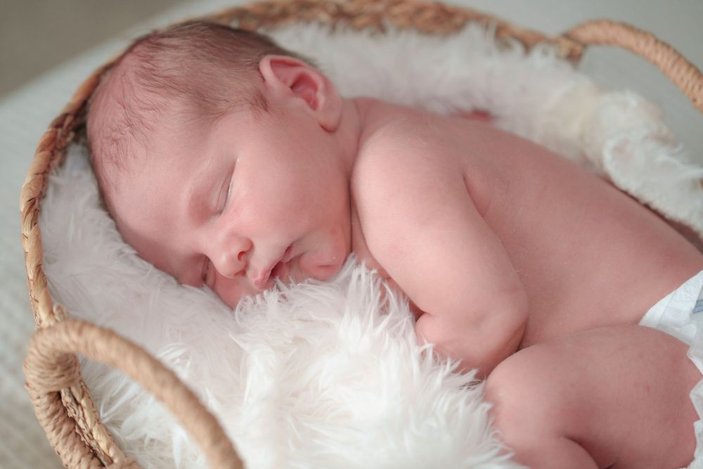 newborn baby boy basket  by the window natural light mom love cuddles candid posed black and white baby boy Dallas Texas big brother