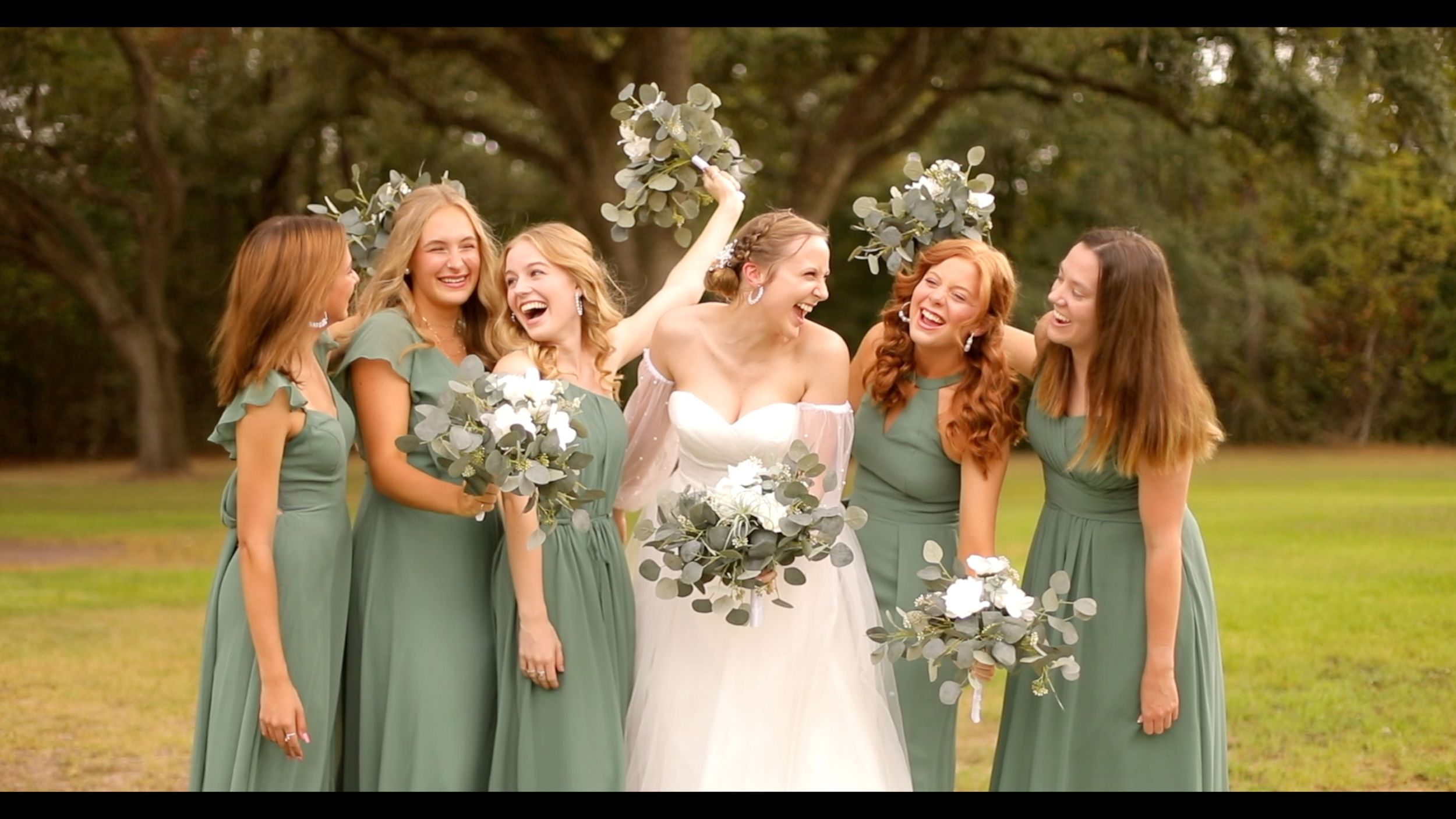 Bride and Bridesmaids Smiling and Laughing Outdoor Wedding Photo Green Bridesmaid Dresses