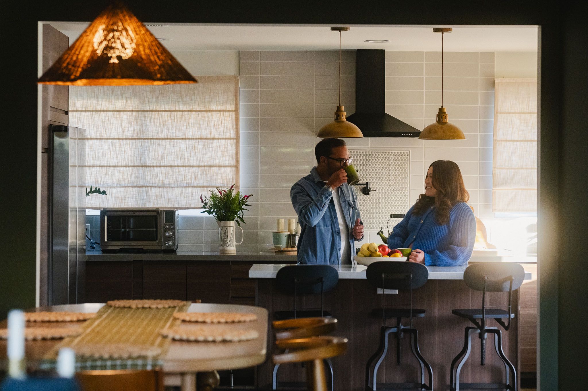 Amanda and Rohan sharing a quiet moment in their kitchen during a Pasadena maternity photoshoot