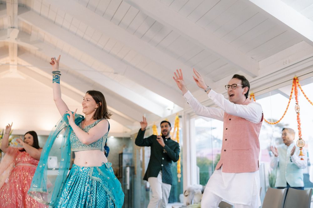 Wedding guests dancing during a lively Sangeet celebration at Casa da Guia in Cascais, Portugal.