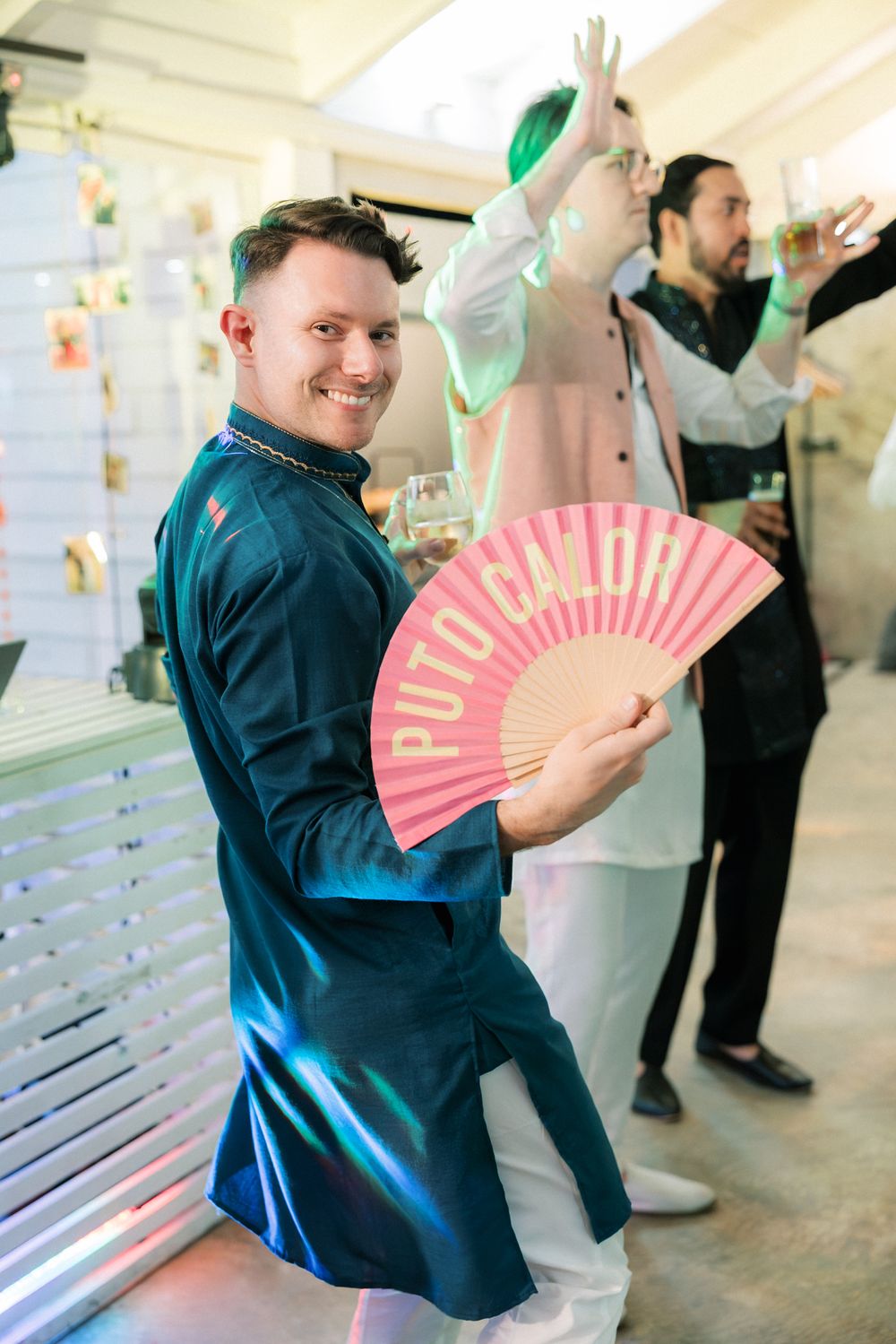 Guests enjoying traditional Sangeet dancing during a seaside wedding celebration in Cascais overlooking the Atlantic Ocean.