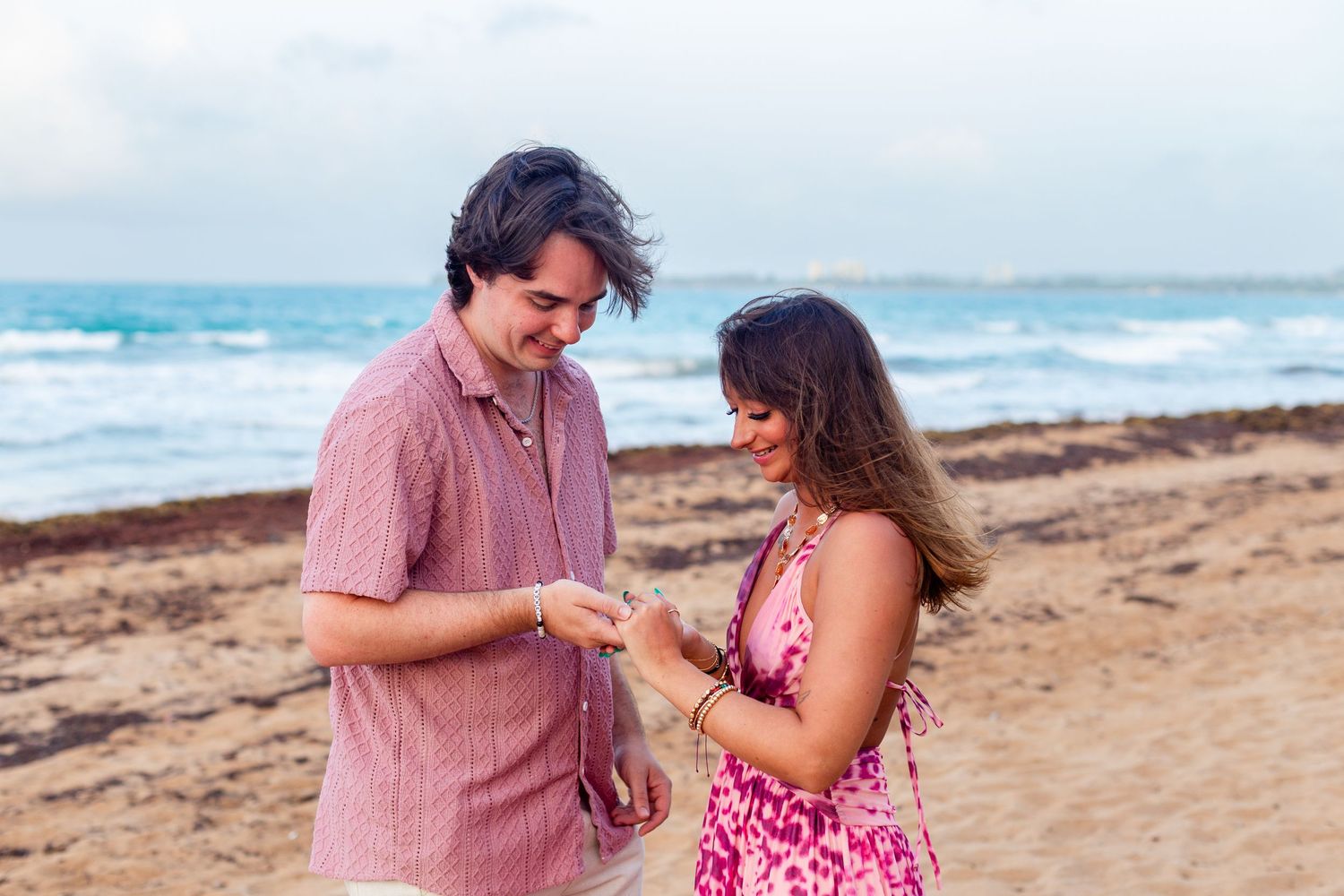 Marriage proposal on the beach. Looking at the ring. Río Grande, Puerto Rico.