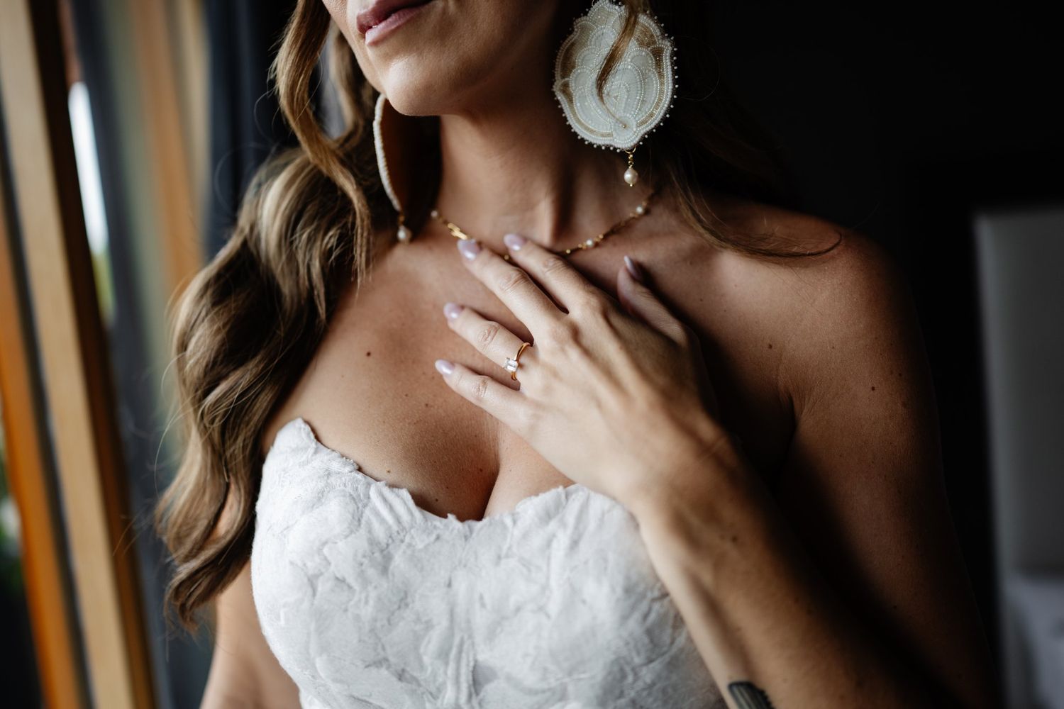 Bride portrait with earrings, Calgary wedding photographer