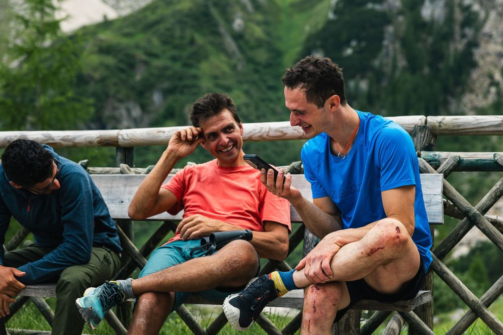 Adam Ondra and Berni Rivadossi celebrating at the hut after climbing the route Egoland on the South Face of Marmolada. Photo: Jan Virt
