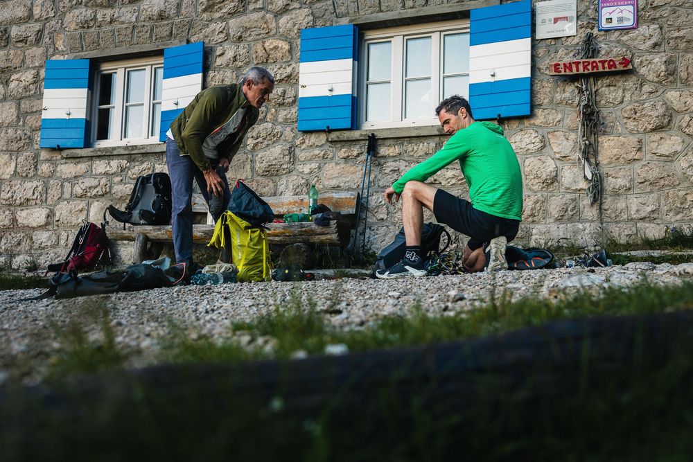 Adam Ondra and Pietro dal Pra preparing gear the day before climbing the Fish route on Marmolada. Photo: Jan Virt