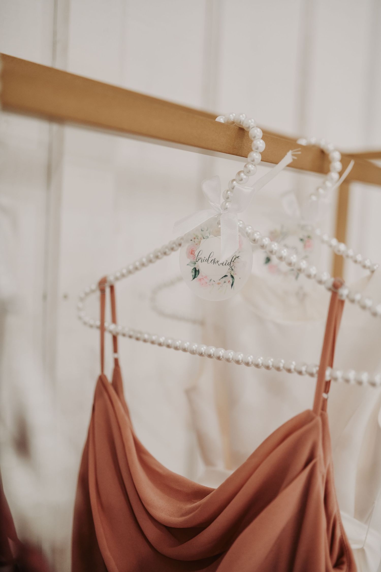 Custom tags created for pearl-studded bridesmaid gowns