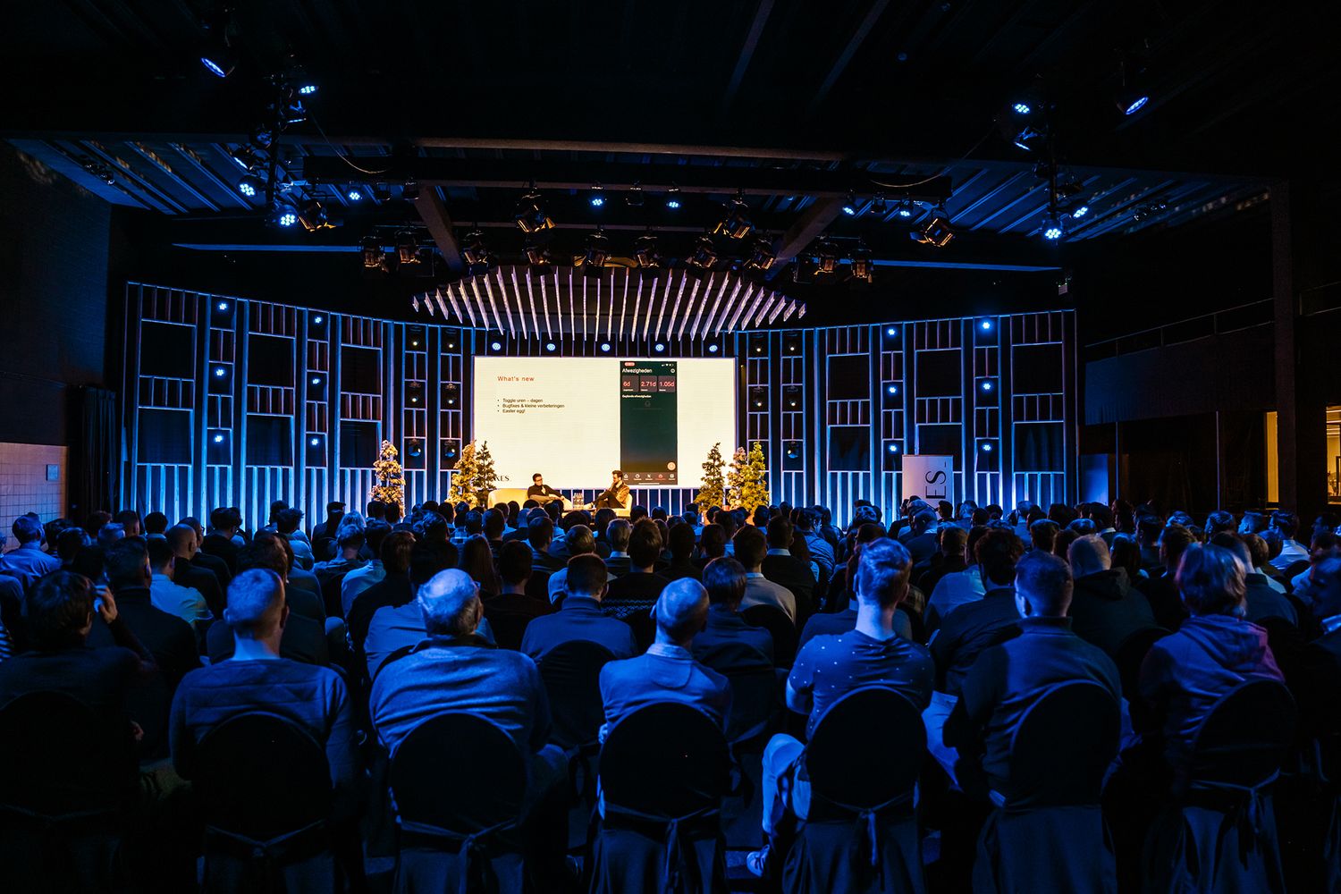 Publiek tijdens een zakelijke lezing op een bedrijfsevent van Axxes