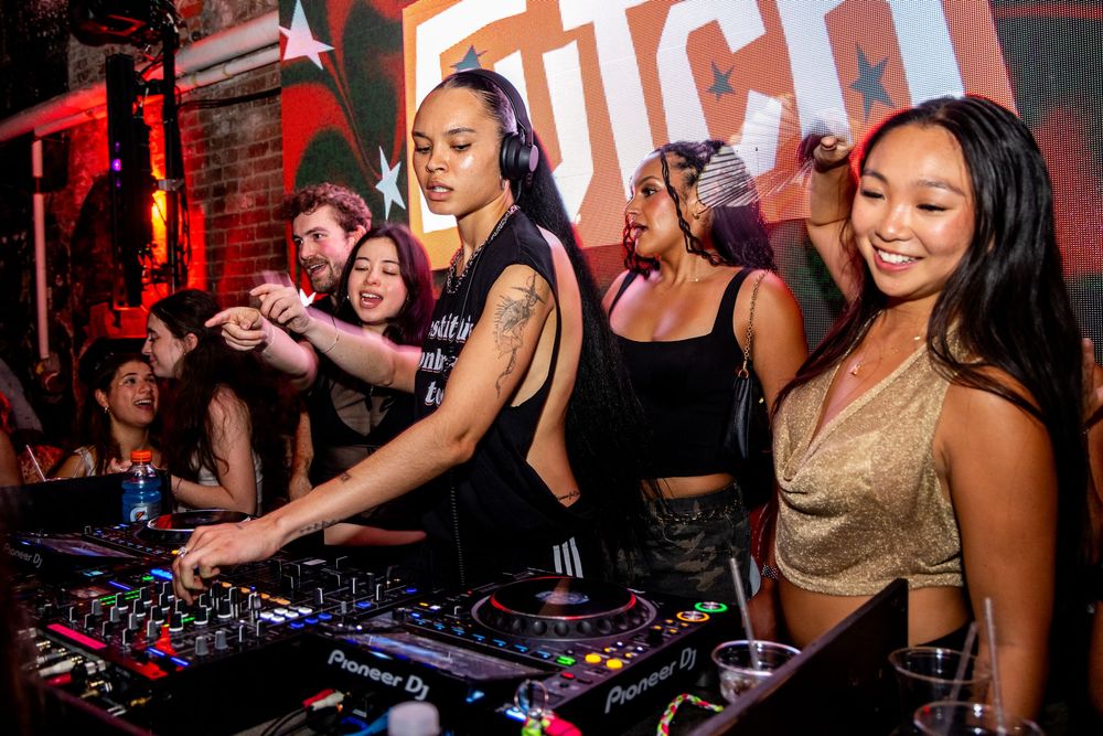 Lesbian DJ set at Futch Night in New York City Brooklyn dyke event by trans nightlife photographer Kade Joy.