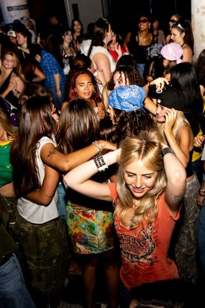New York City queer dance party attendees dance at the club photographed by lesbian nightlife photographer Kade Joy.