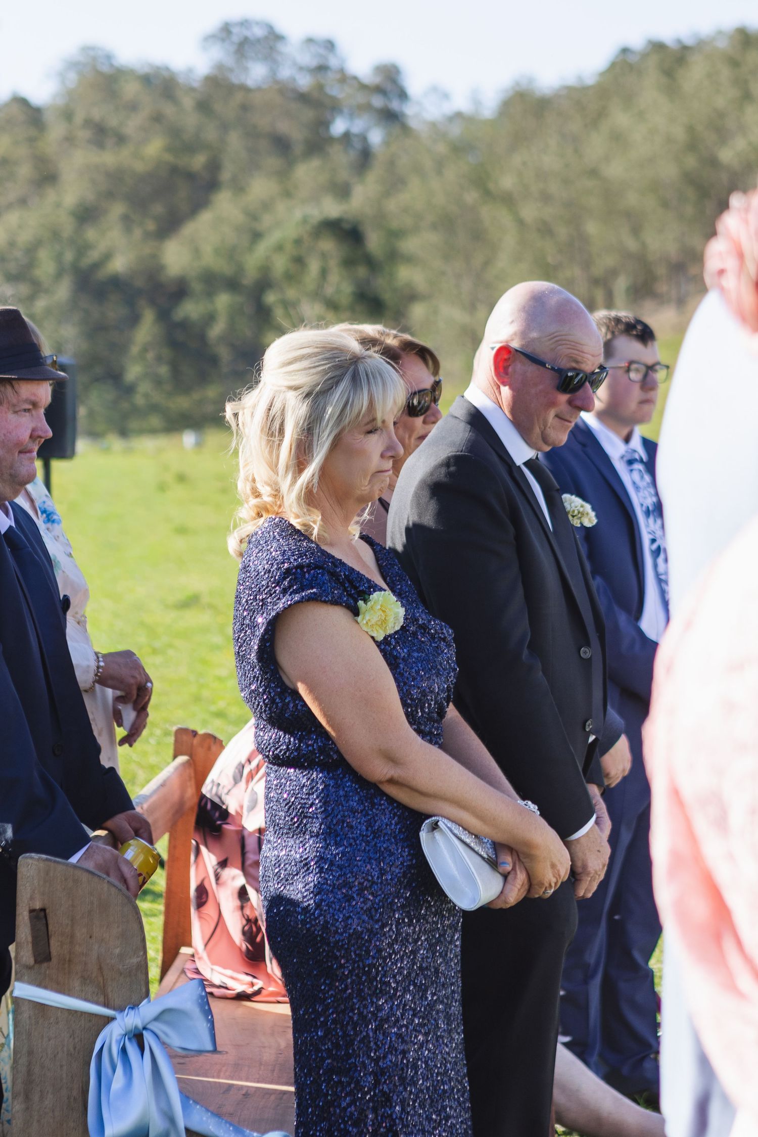 Mother and father of the bride at Jess and Lachie’s wedding ceremony overlooking the dam at Dungog Weddings