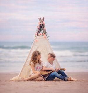 Boy and girl together during a beach portrait session in Stone Harbor, New Jersey.