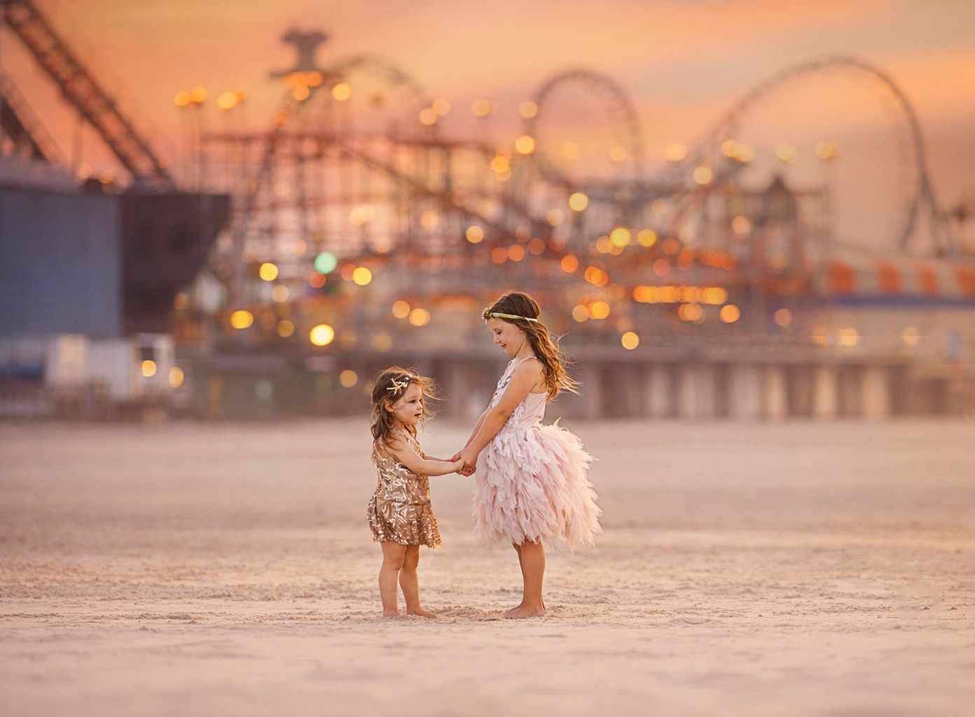 Two girls posing for a beach portrait session in Wildwood, New Jersey, photographed by a professional family photographer.