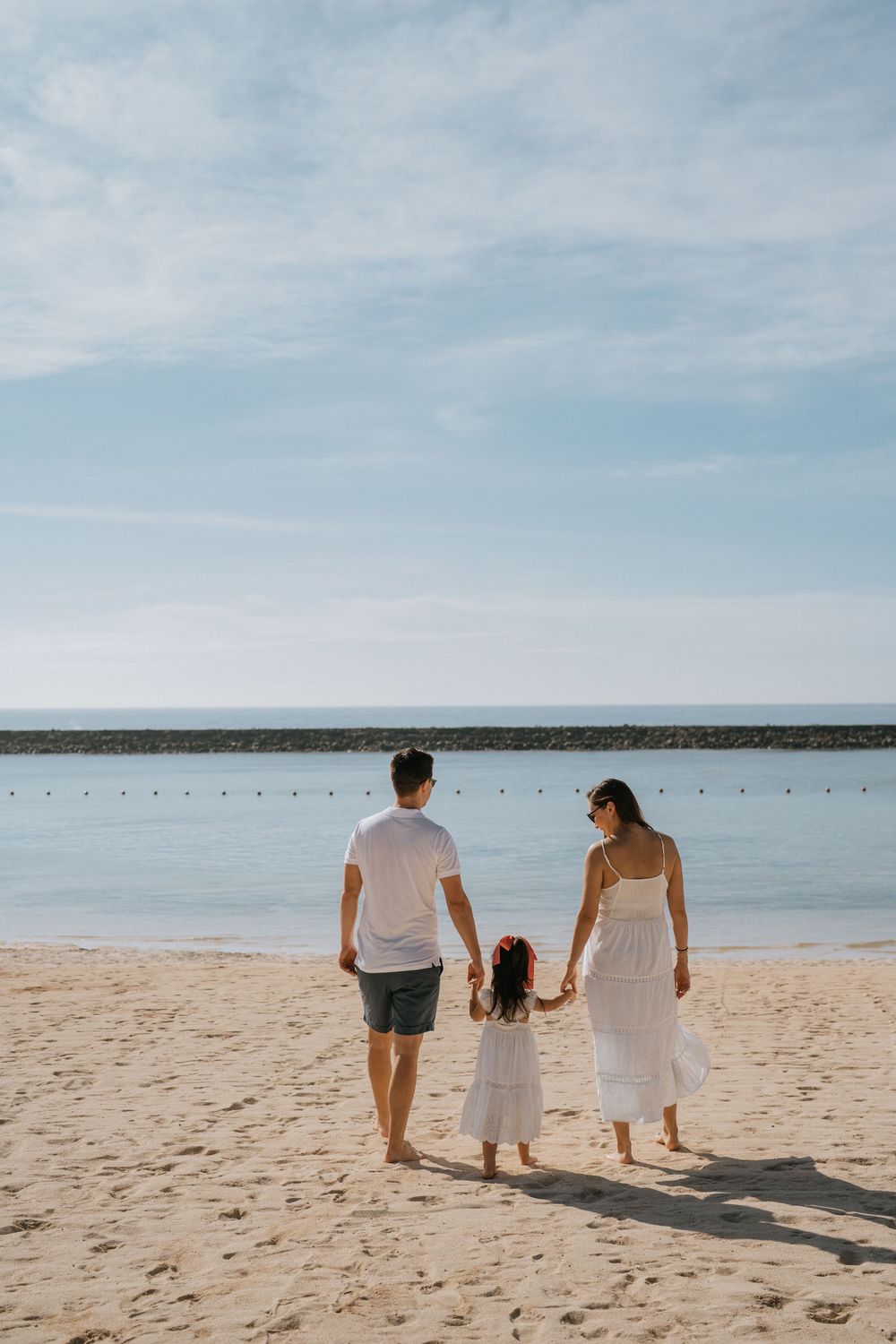 Luxury family photography session at The Apurva Kempinski Bali resort.