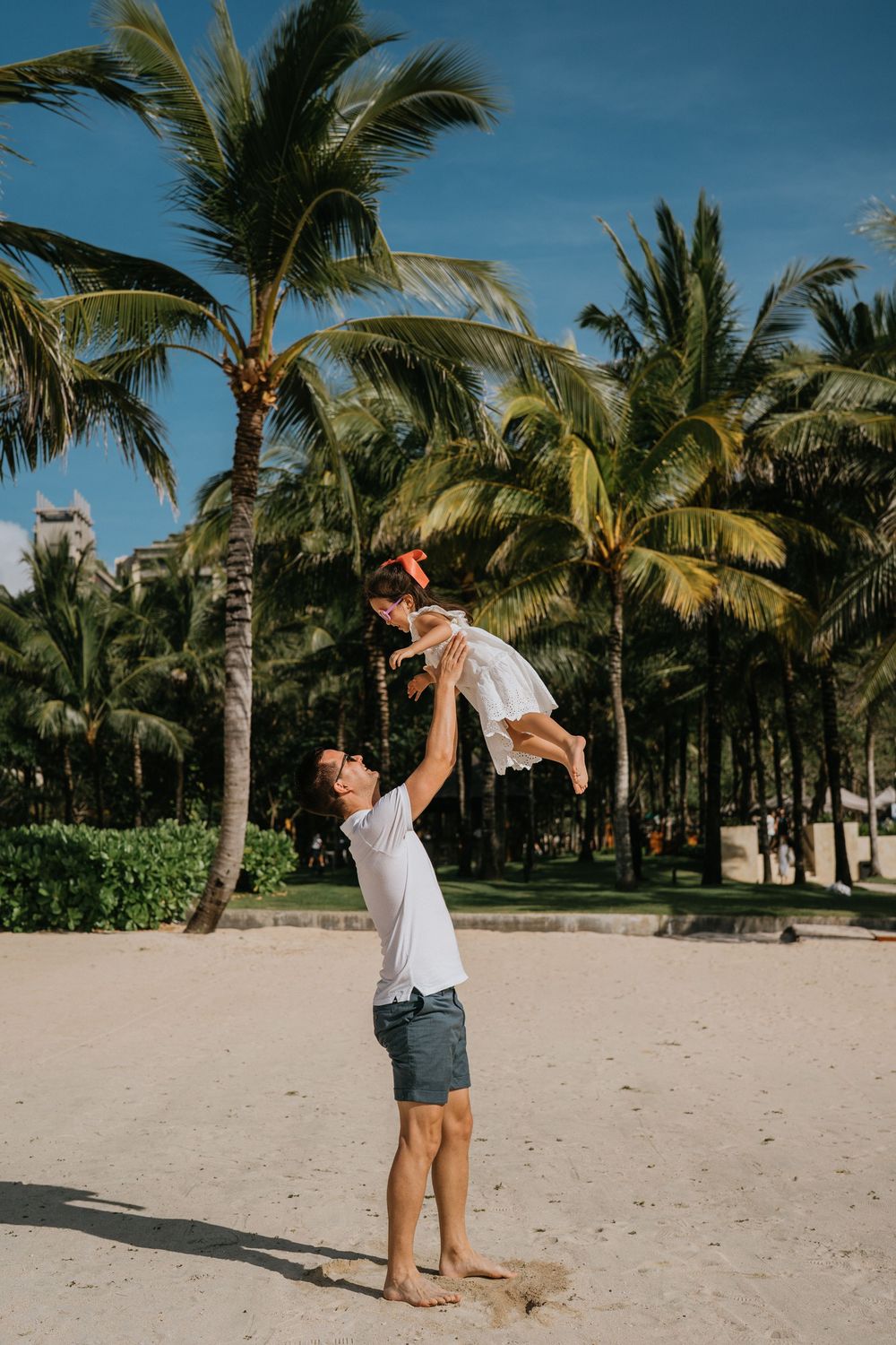 Professional family photographer capturing moments at The Apurva Kempinski Bali.