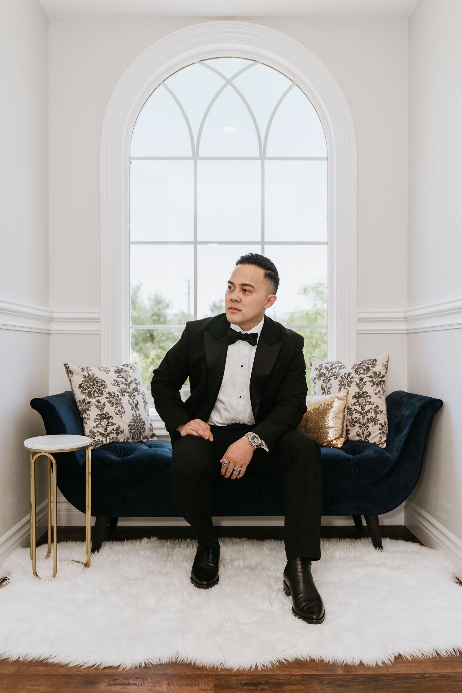 Paul seated for a formal groom portrait at The Vine House