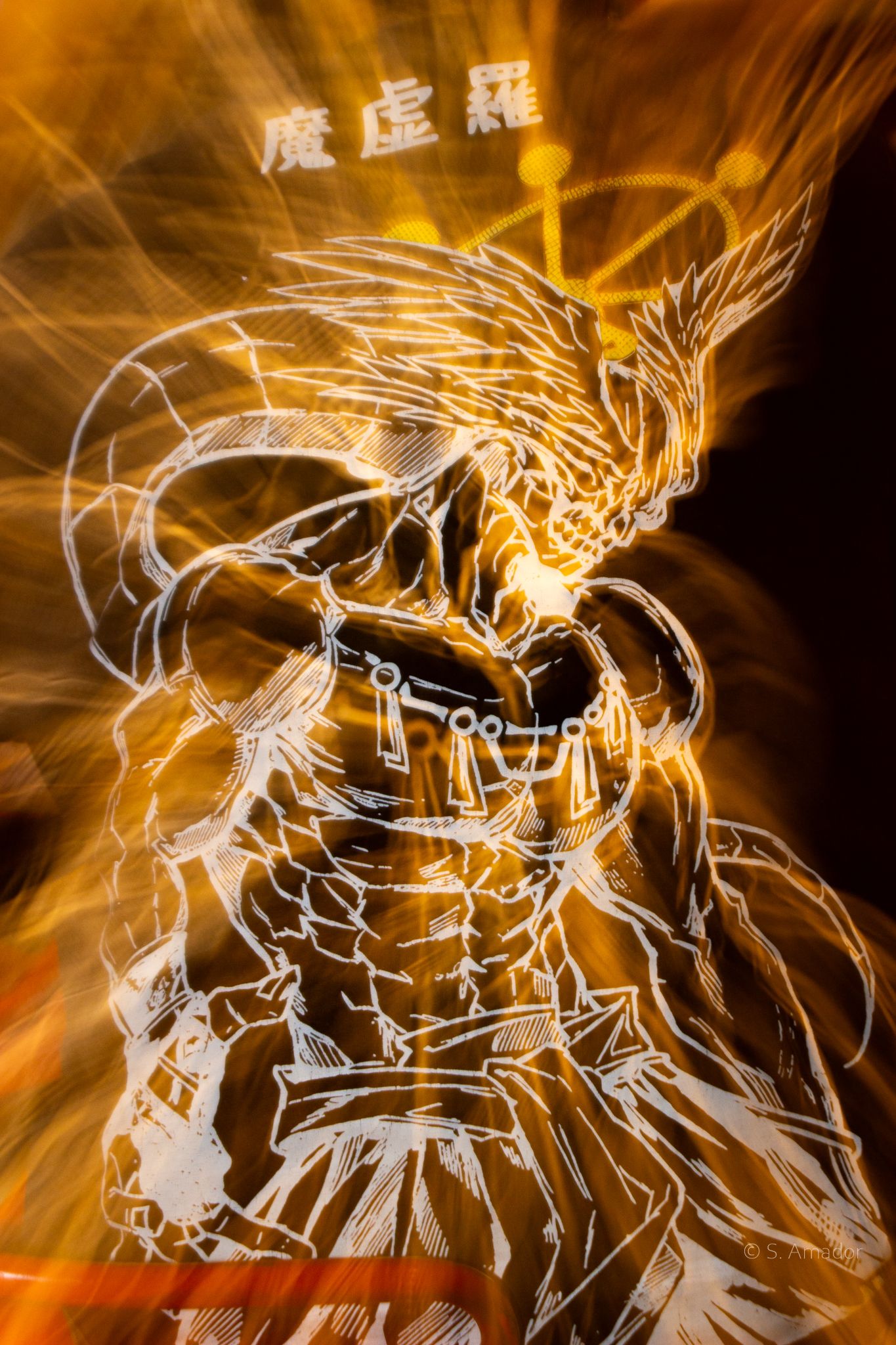 Dynamic golden light burst illuminates a fierce warrior manga illustration with Chinese characters in the background.