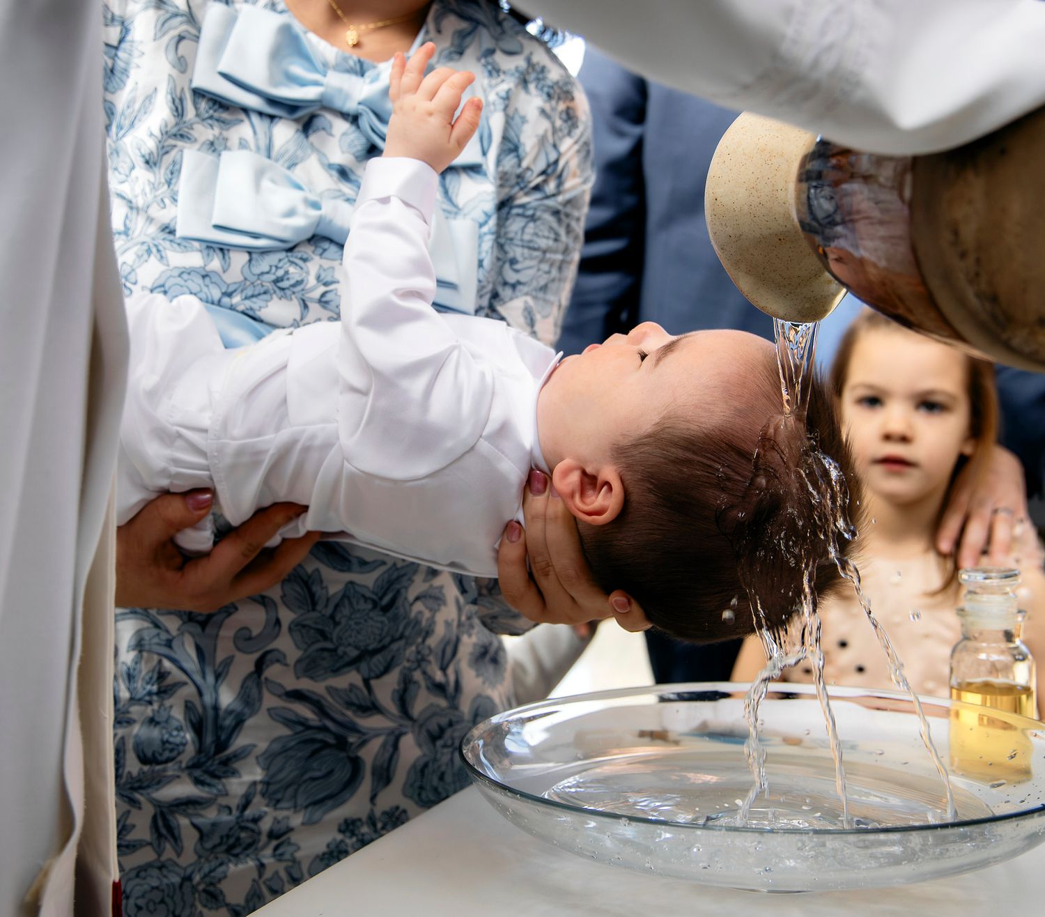 A sequence showing someone washing their hair in a sink, captured in multiple stages of the process.