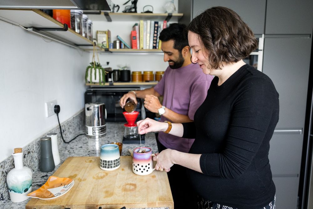 couple making coffee in their kitchen in hackney east london