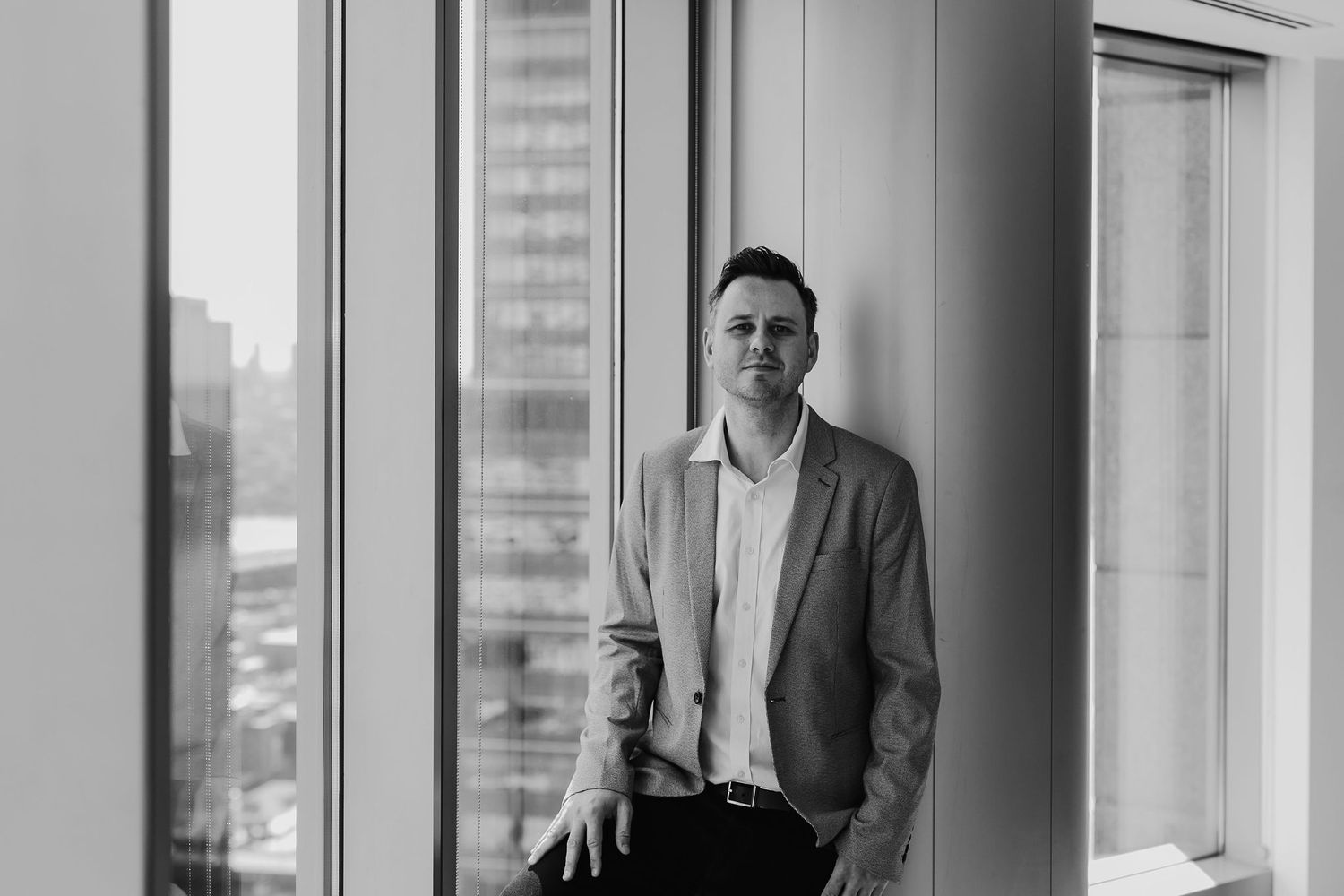 Black and white corporate headshot photo by Martine Payne