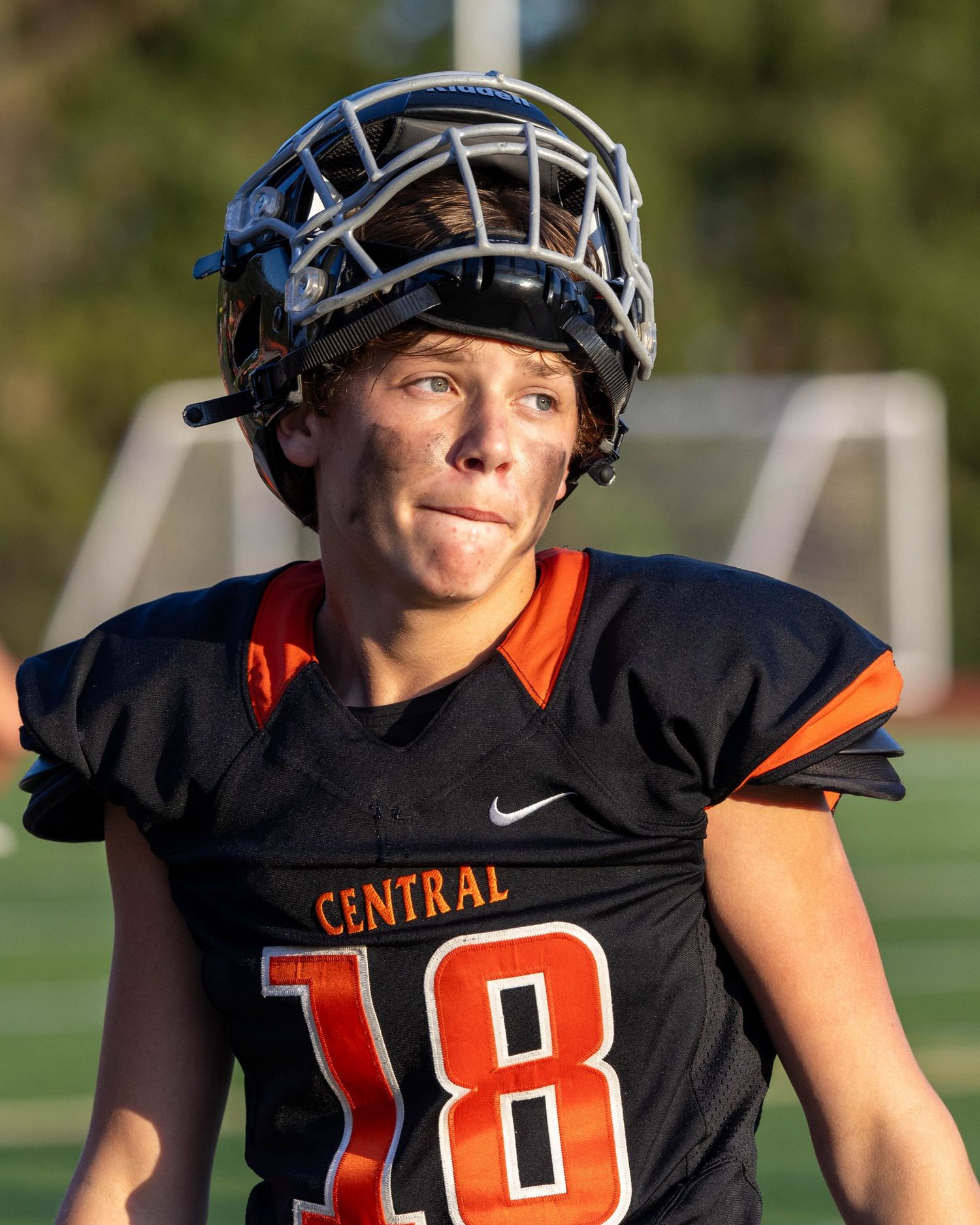 High school football player wearing a black Central jersey and helmet.